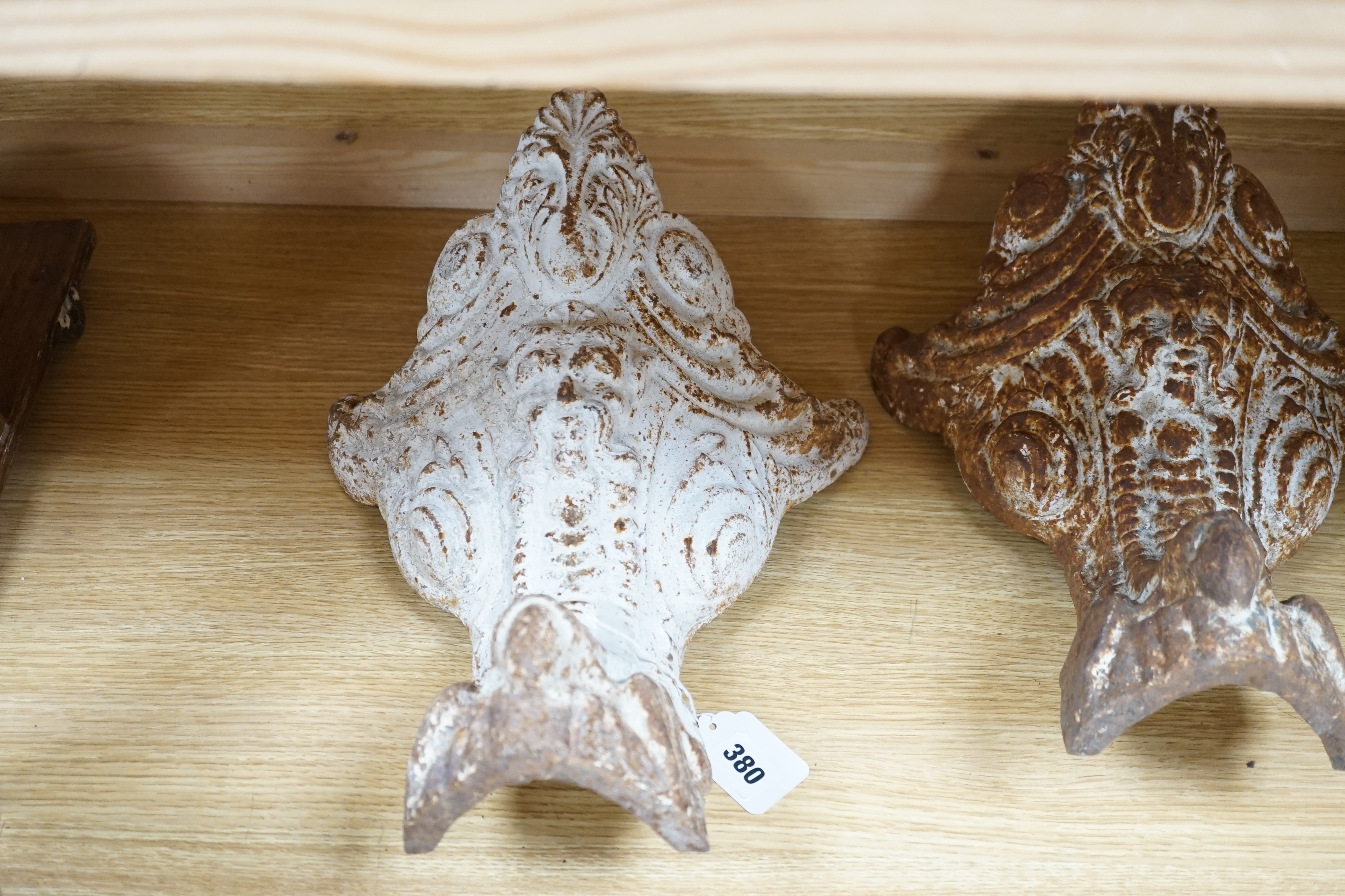 Three Victorian cast iron bath feet, 41cms high